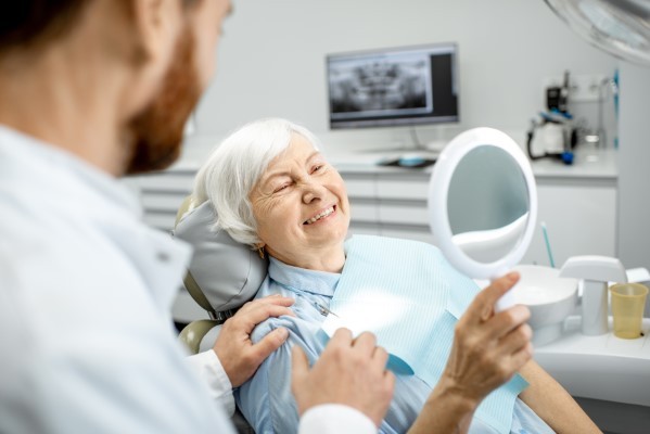 According to the Centers for Disease Control and Prevention, 69 percent of adults have lost at least one permanent tooth due to decay, gum disease or injury. Lost teeth affect your ability to smile with confidence or speak and chew properly, impacting your quality of life. Fortunately, the skilled professionals at the office of Greenwich Smiles can help reestablish the look, feel and function of a naturally beautiful and complete smile. Missing teeth not only affects your appearance, it can also alter your bite, impair oral function and reduce support for natural contours of your face to produce a more haggard look. Implants differ from traditional dental prostheses, such as conventional fixed bridges or dentures, because the lowermost portion of an implant functions in much the same way as the root of a natural tooth. Once placed and integrated with the surrounding bone, dental implants can be used to secure custom crowns, fixed bridges or implant-retained dentures, and can even be placed strategically to support an entire set of upper or lower teeth. In addition, dental implants can be placed to restore missing teeth, without requiring the involvement the adjacent teeth. From designing your implants with the latest technology and techniques, to the complete restoration of your smile, our team will provide the individualized attention you deserve in addition to useful tips on how to take care of your new dental implants. Your trusted partner in dental care At the office of Greenwich Smiles, we believe that everyone deserves to smile with confidence. Our expert staff keeps you comfortable, relaxed and informed at each stage of the dental implant process, delivering the results you want. For more information on implants and other services we provide, give us a call today.